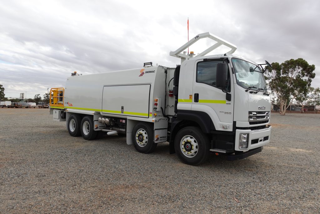 Isuzu FVM 360 carrying a Shermac 8x4 mine-spec service body on WA gravel pre-delivery yard