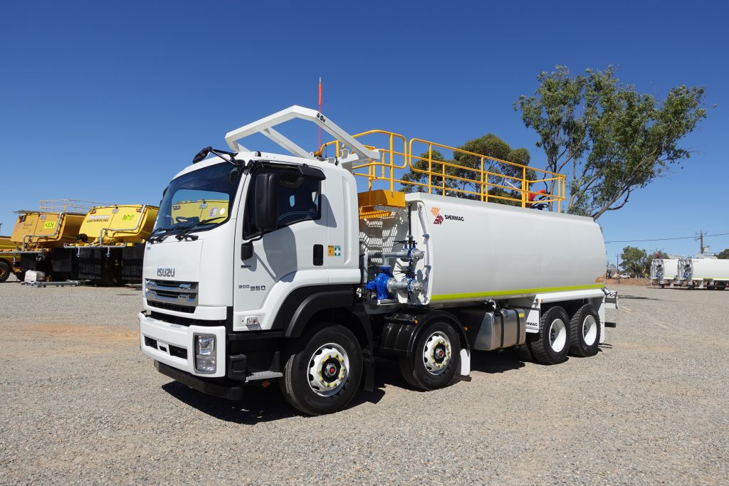 Shermac RS2000 8x4 water cart on Isuzu FVZ at WA delivery yard, other builds behind