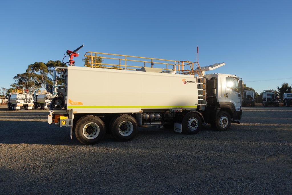 Full side profile at golden hour, Shermac RS2000 8x4 water cart with fleet at WA facility