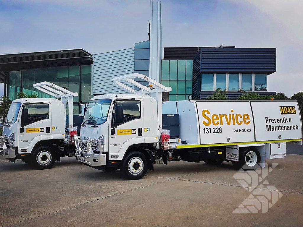 Fleet of compact Shermac service trucks set up for preventive maintenance and efficient on-site servicing operations.