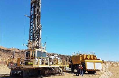 Shermac mine-spec service truck supporting large mining excavator on Australian site, showcasing service truck fleet management in action
