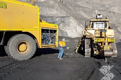 Shermac mine-spec service truck on site refuelling and servicing heavy mining equipment in open-cut operation