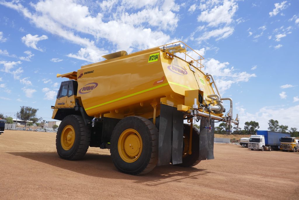 NRW fleet RS5000, a Shermac off-road water cart on a Komatsu haul truck base on red dirt WA