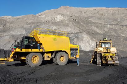 Shermac off-road service truck supporting heavy mining equipment at an open-cut mine site.